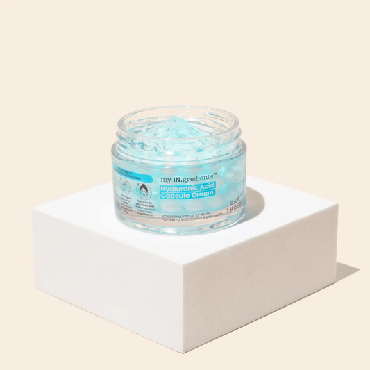 Masque BAR my iN.gredients Hyaluronic Acid Capsule Cream in an open glass jar, showing its blue gel-cream and hydrating capsules, a vegan, fragrance-free moisturiser with hyaluronic acid, niacinamide and shea butter for dry, mature, dehydrated skin.
