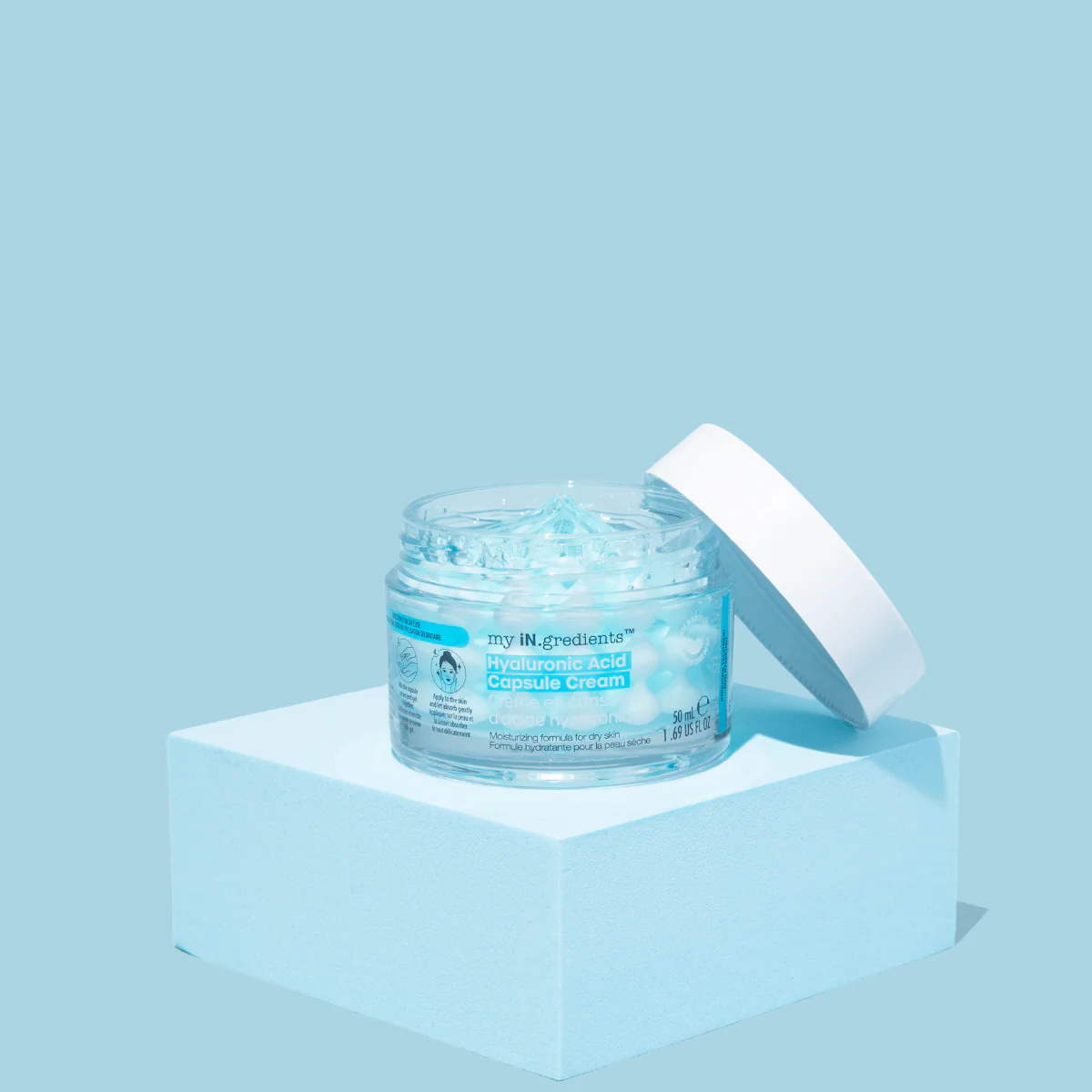 Masque BAR my iN.gredients Hyaluronic Acid Capsule Cream in an open glass jar, showing its blue gel-cream and hydrating capsules, a vegan, fragrance-free moisturiser with hyaluronic acid, niacinamide and shea butter for dry, mature, dehydrated skin.