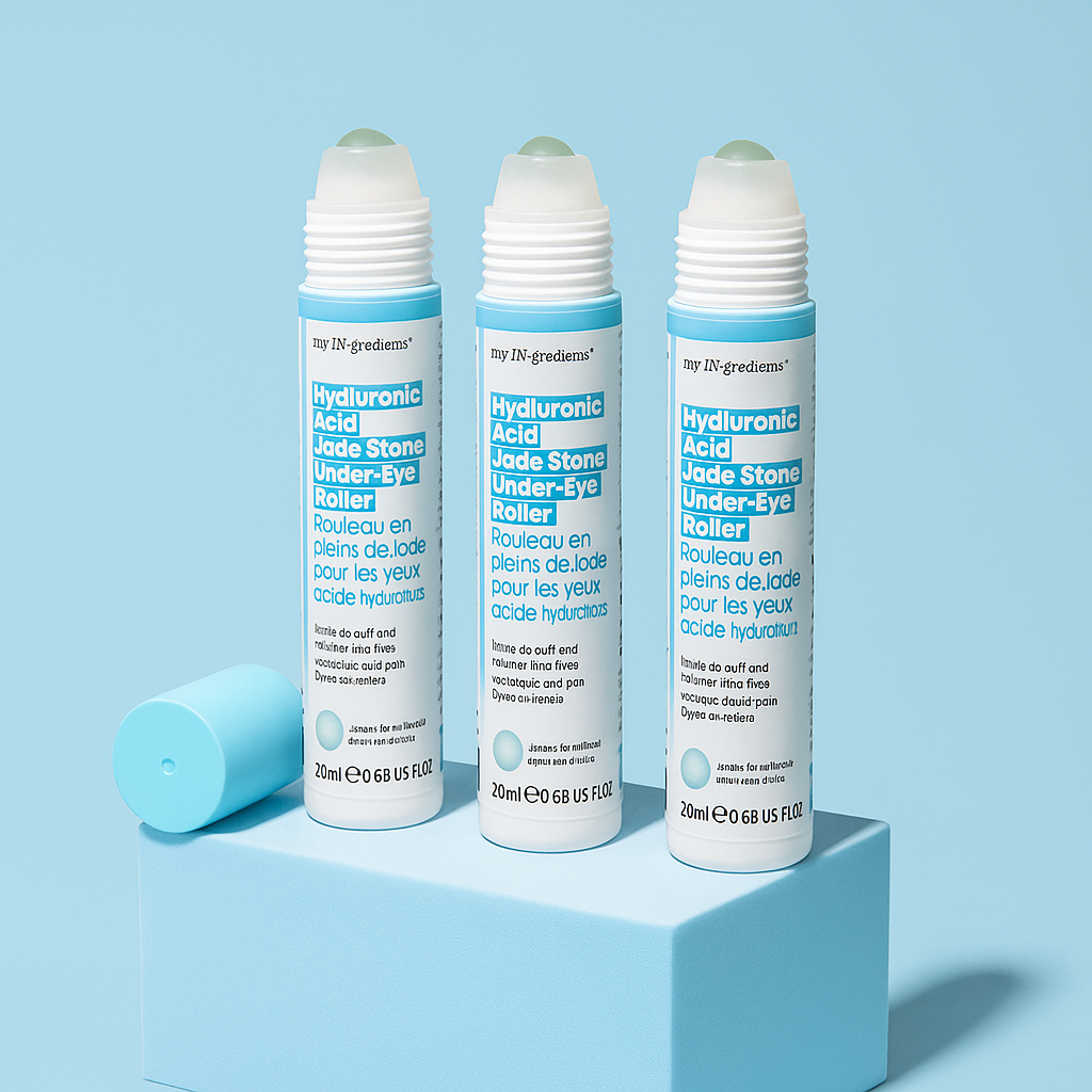 Slim turquoise tube of Masque BAR my iN.gredients Hyaluronic Acid Jade Stone Under-Eye Roller with jade tip exposed on a blue background, a cooling vegan treatment that hydrates, brightens dark circles and softens fine lines under the eyes.