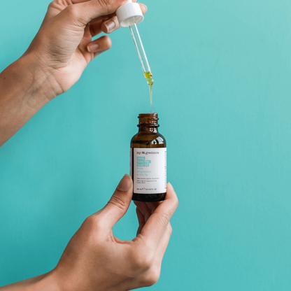 Amber glass bottle of my iN.gredients 100% Rose Hip Seed Oil 30ml with white dropper and minimal turquoise label, shown against a soft blue background, highlighting its pure, vegan formula for hydrating and soothing dull, dry, itchy facial skin.