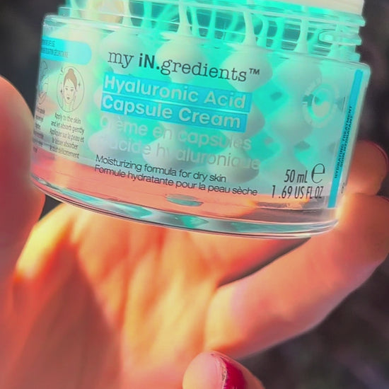 Masque BAR my iN.gredients Hyaluronic Acid Capsule Cream in an open glass jar, showing its blue gel-cream and hydrating capsules, a vegan, fragrance-free moisturiser with hyaluronic acid, niacinamide and shea butter for dry, mature, dehydrated skin.