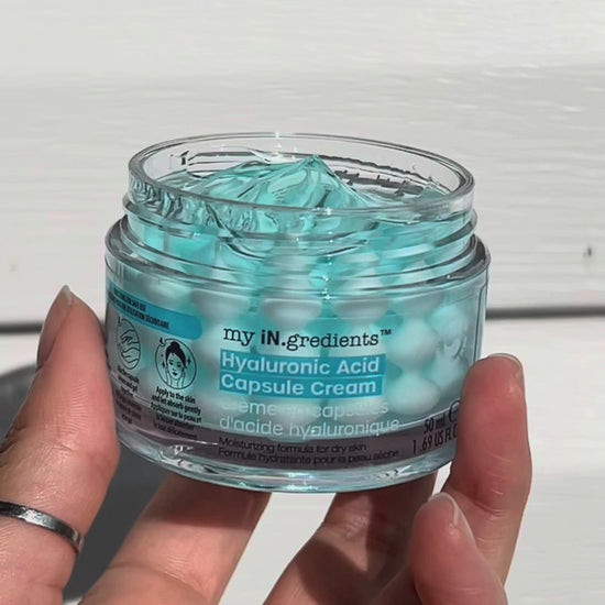Masque BAR my iN.gredients Hyaluronic Acid Capsule Cream in an open glass jar, showing its blue gel-cream and hydrating capsules, a vegan, fragrance-free moisturiser with hyaluronic acid, niacinamide and shea butter for dry, mature, dehydrated skin.