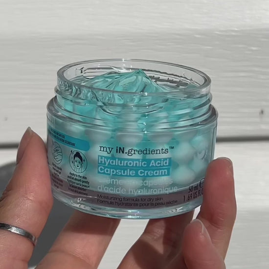Masque BAR my iN.gredients Hyaluronic Acid Capsule Cream in an open glass jar, showing its blue gel-cream and hydrating capsules, a vegan, fragrance-free moisturiser with hyaluronic acid, niacinamide and shea butter for dry, mature, dehydrated skin.
