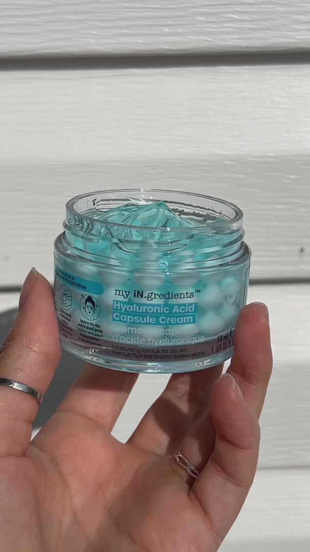 Masque BAR my iN.gredients Hyaluronic Acid Capsule Cream in an open glass jar, showing its blue gel-cream and hydrating capsules, a vegan, fragrance-free moisturiser with hyaluronic acid, niacinamide and shea butter for dry, mature, dehydrated skin.